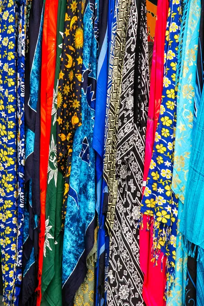 Multicoloured silk scarves on a market stall in Madeira — Stock Photo, Image