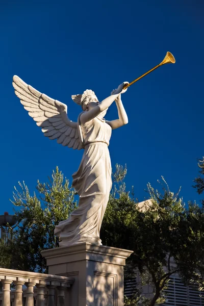 Angel playing golden bugle — Stock Photo, Image