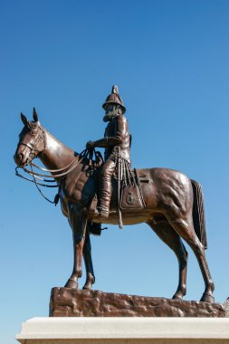 Statue of James Macleod outside Fort Calgary clipart