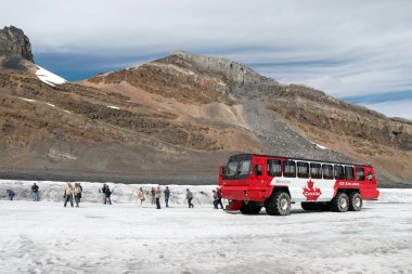 Brewster Ice Explorer parked on the Athabasca Glacier clipart