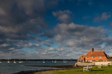 House on the coastline at Bosham near Chichester clipart