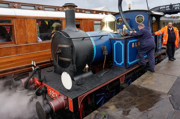 Bluebell steam engine taking on water — Stock Photo, Image