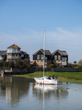 Yacht cruising down the Swale to Faversham Kent on March 29, 201 clipart