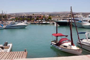 Assortment of boats in the harbour at Latchi clipart