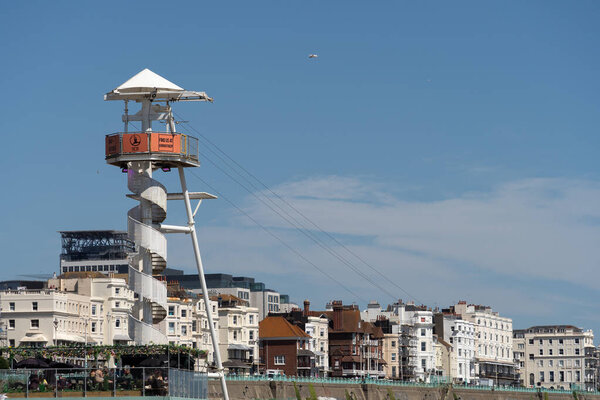Brighton, East Sussex, UK - July 15, 2022 : View of the beachfront and zip wire in Brighton on July 15, 2022. Unidentified people