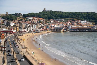 SCARBOROUGH,  NORTH YORKSHIRE, UK - JULY 18: View of the sea front in Scarborough, North Yorkshire on July 18, 2022. Unidentified people