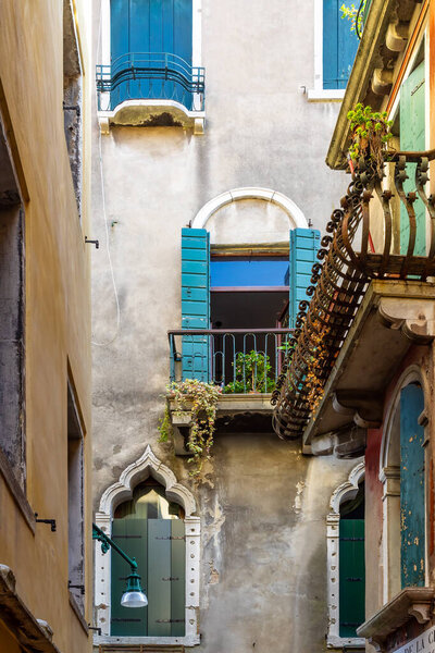 VENICE, ITALY - OCTOBER 12 : Ornate windows in Calle de la Mandola, Venice on October 12, 2014