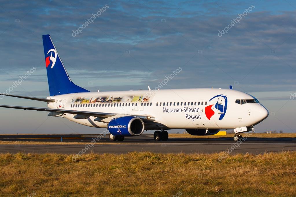 PRAGUE, CZECH REPUBLIC - JANUARY 07: Boeing 737-800 Travel Service taxis to terminal in PRG Airport on January 07, 2014. This plane is logojet of Moravian- Silesian Region