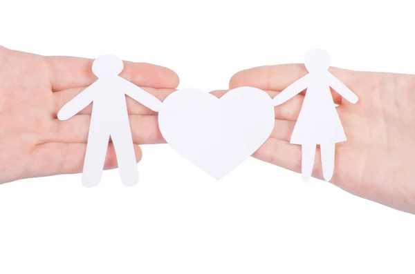 Paper family in hand with a big hearth isolated on white — Stock Photo, Image