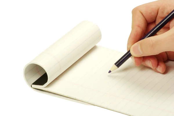 Pencil in hand writing on the notebook — Stock Photo, Image