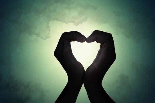 Láska tvar ruky silhouette — Stock fotografie