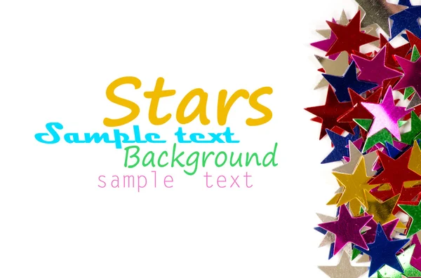 Juldekoration av färgade konfetti stjärnor — Stockfoto