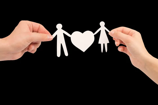 Paper family in hands isolated on black background — Stock Photo, Image