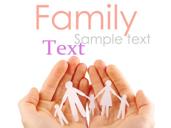 Papier familie in handen geïsoleerd op witte achtergrond — Stockfoto