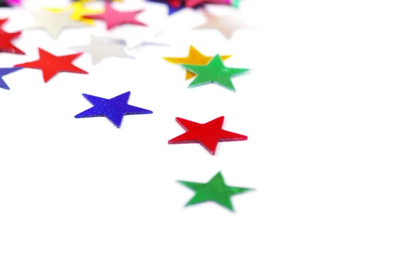 Christmas decoration of colored confetti stars — Stock Photo, Image