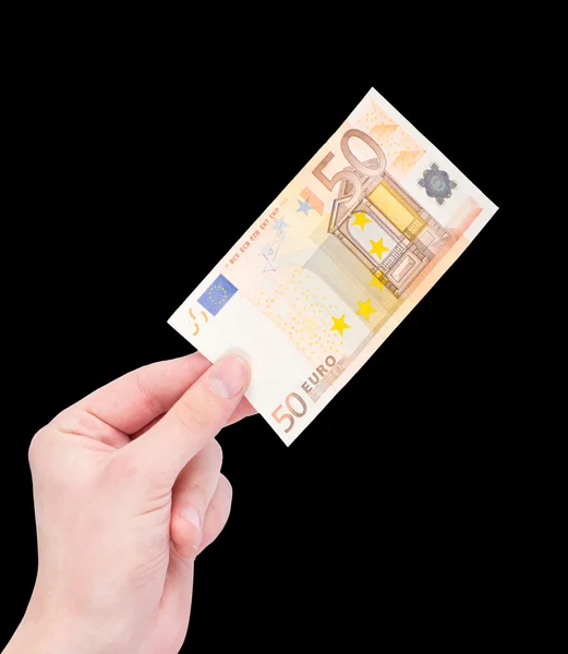 Peníze (euro) v ruce izolované na černém pozadí — Stock fotografie