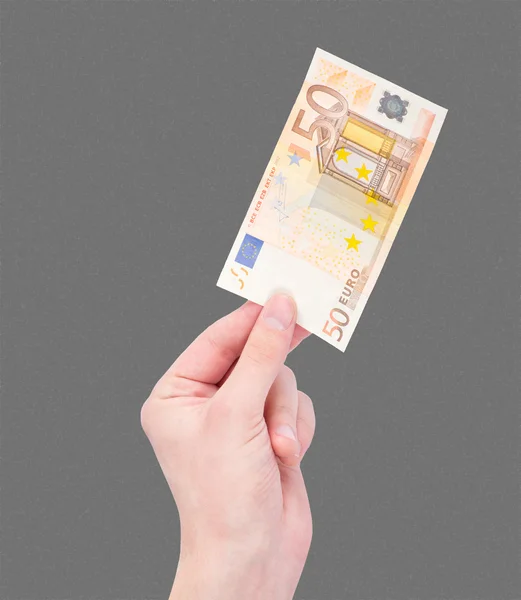 Dinero (euros) en una mano aislada sobre negro — Foto de Stock