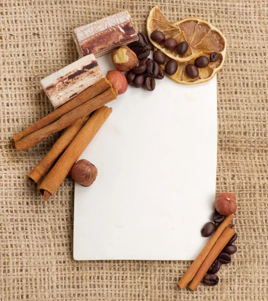 Old paper for recipes and spices on burlap closeup — Stock Photo, Image