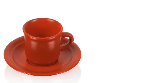 Červený pohár na červený talířek — Stock fotografie