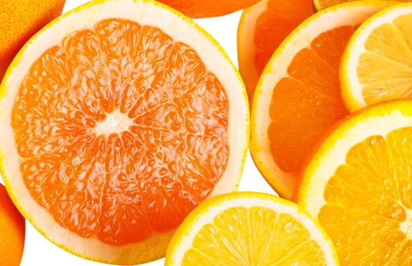 Vitamin C Overload, Stacks of sliced fruit isolated on white — Stock Photo, Image