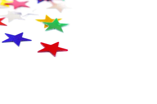 Christmas decoration of colored confetti stars — Stock Photo, Image