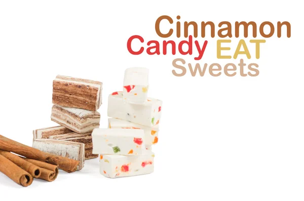 Sweets and cinnamon sticks isolated on white background — Stock Photo, Image