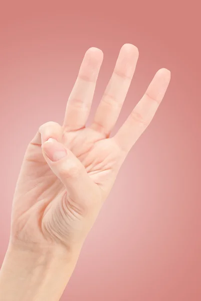 Frauenhände zählen Nummer drei isoliert auf weiß — Stockfoto