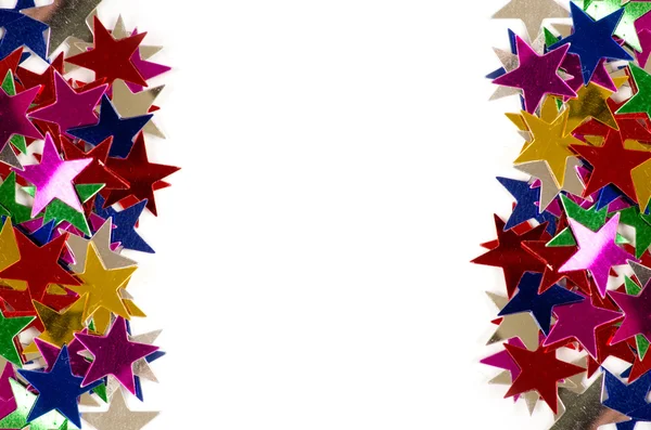 Christmas decoration of colored confetti stars — Stock Photo, Image