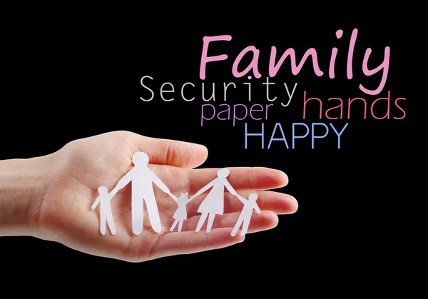 Papírová rodina v rukou — Stock fotografie