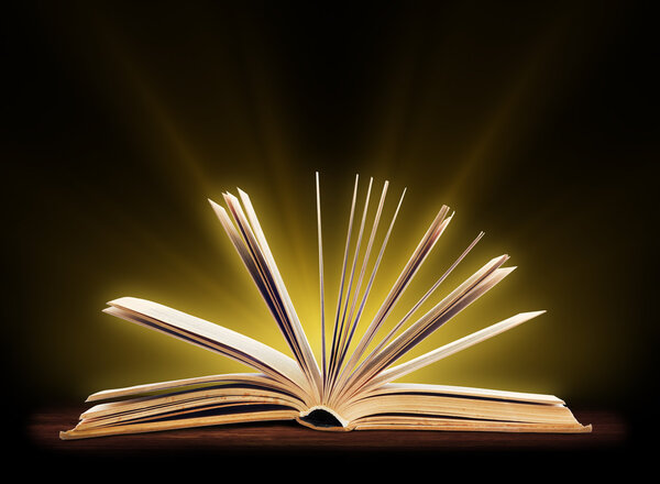 Book. Opened book with special light. Education