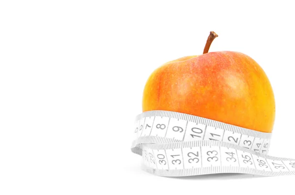 Äpfel messen den Meter auf einem weißen — Stockfoto