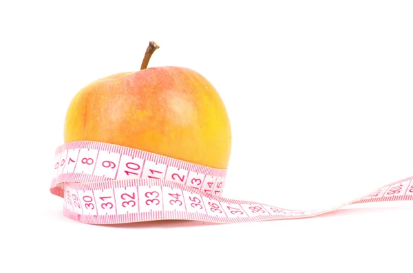 Pommes mesurées le mètre sur un blanc — Photo