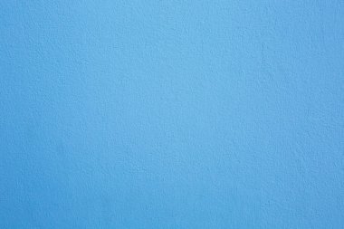 Beton bir duvar maviye boyanmış. Arkaplan, doku.