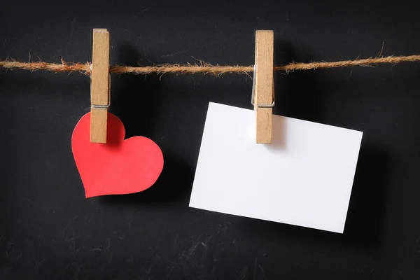 Heart with empty poster hanging — Stock Photo, Image