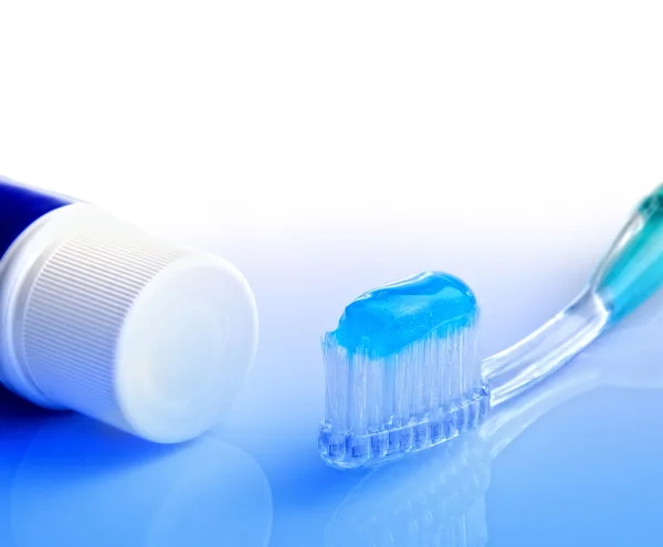 Toothbrush and toothpaste tube — Stock Photo, Image