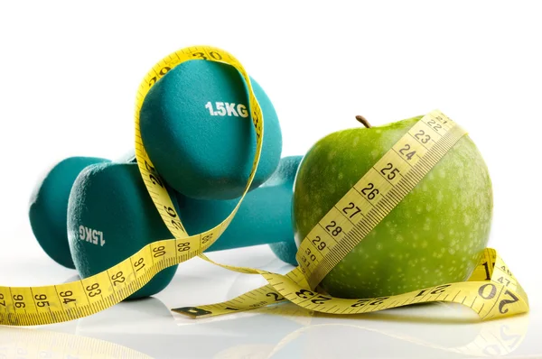 Healthy apple, measuring tape and dumbbells isolated — Stock Photo, Image