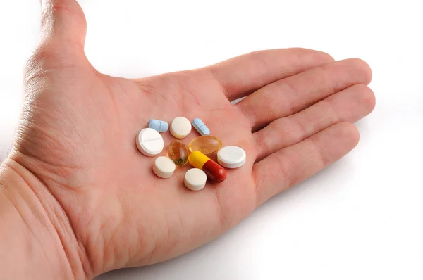 Offered pills on hand — Stock Photo, Image