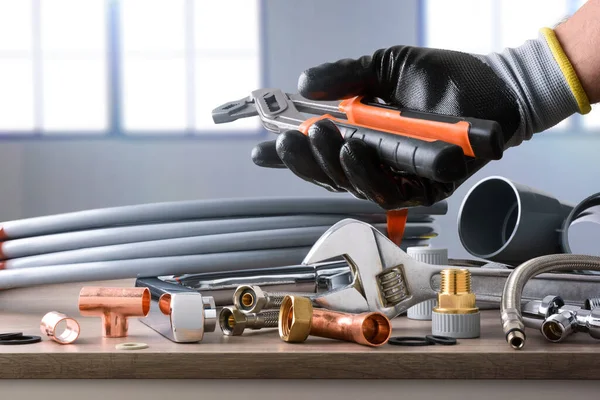 Sample Plumbing Materials Tools Workbench Hand Showing Parrot Beak Pliers — Stockfoto