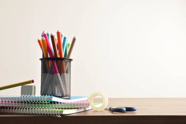 School Supplies Pen Markers Notebooks Tools Wooden Desk Front View — Stockfoto