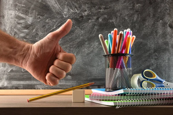 School Supplies Wooden Table Blackboard Background Finger Gesture Front View — Stockfoto