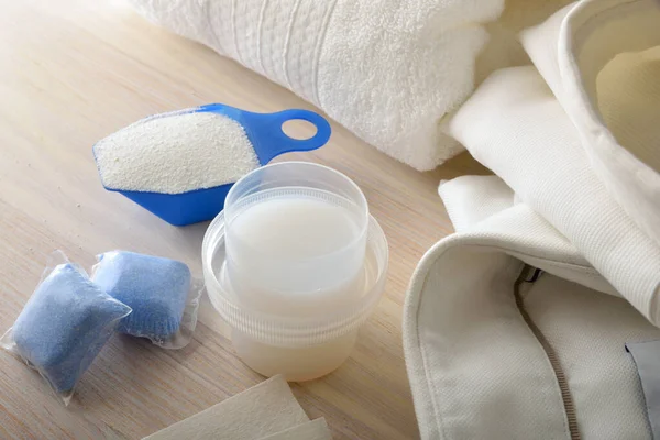 Detail Different Types Laundry Detergents Wooden Table Freshly Washed Folded — Stock fotografie