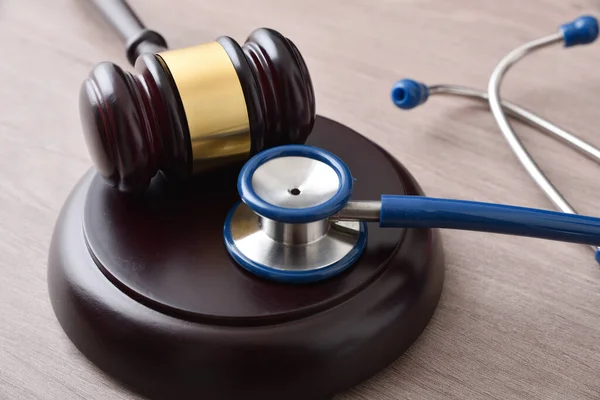 Fair Social Justice Concept Gavel Stethoscope Wooden Table Elevated View — Stock Photo, Image