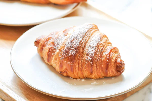 croissant , French croissant or French bread or custard croissant with powered sugar or icing sugar topping for serve