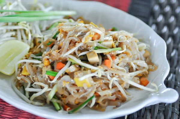 noodles or stir fried noodles, Thai noodles or Pad Thai with lime and vegetable