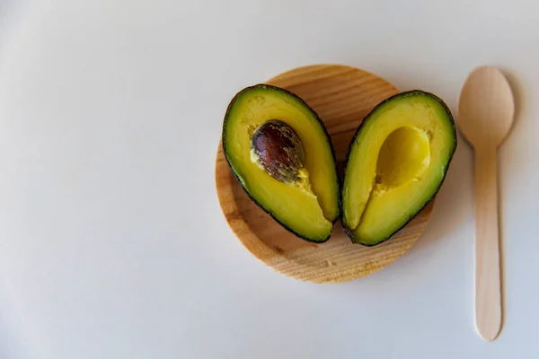 Avocado Ecological Wooden Plate White Background Close Heart Two Avocado — Stock Fotó