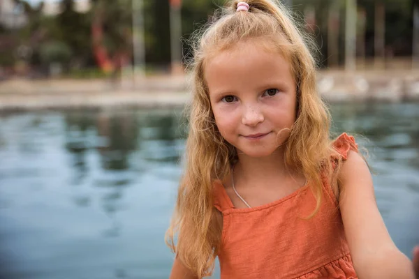 Children walk and play in the city park, the concept of a healthy lifestyle and family leisure