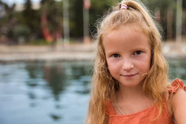 Children walk and play in the city park, the concept of a healthy lifestyle and family leisure