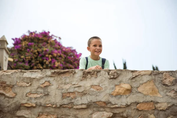Family spending time together, cheerful parent with kids walking in the park in good weather