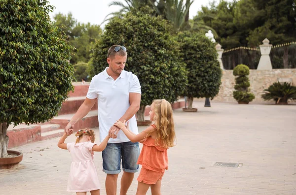 Father and son walk in the city park, the concept of family rest and healthy rest of life
