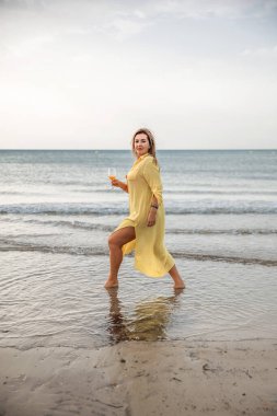 Portrait of a woman on the beach, ocean, unity with nature, healthy lifestyle